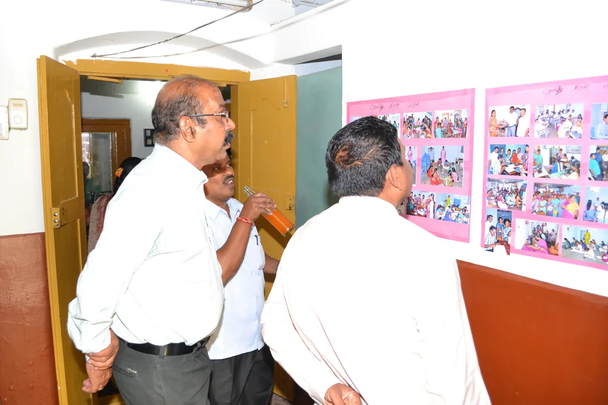 NABARD Manager Mr. Mani and Lead Bank Manager Mr. Mahendran reviewing photo documentation at NWDT