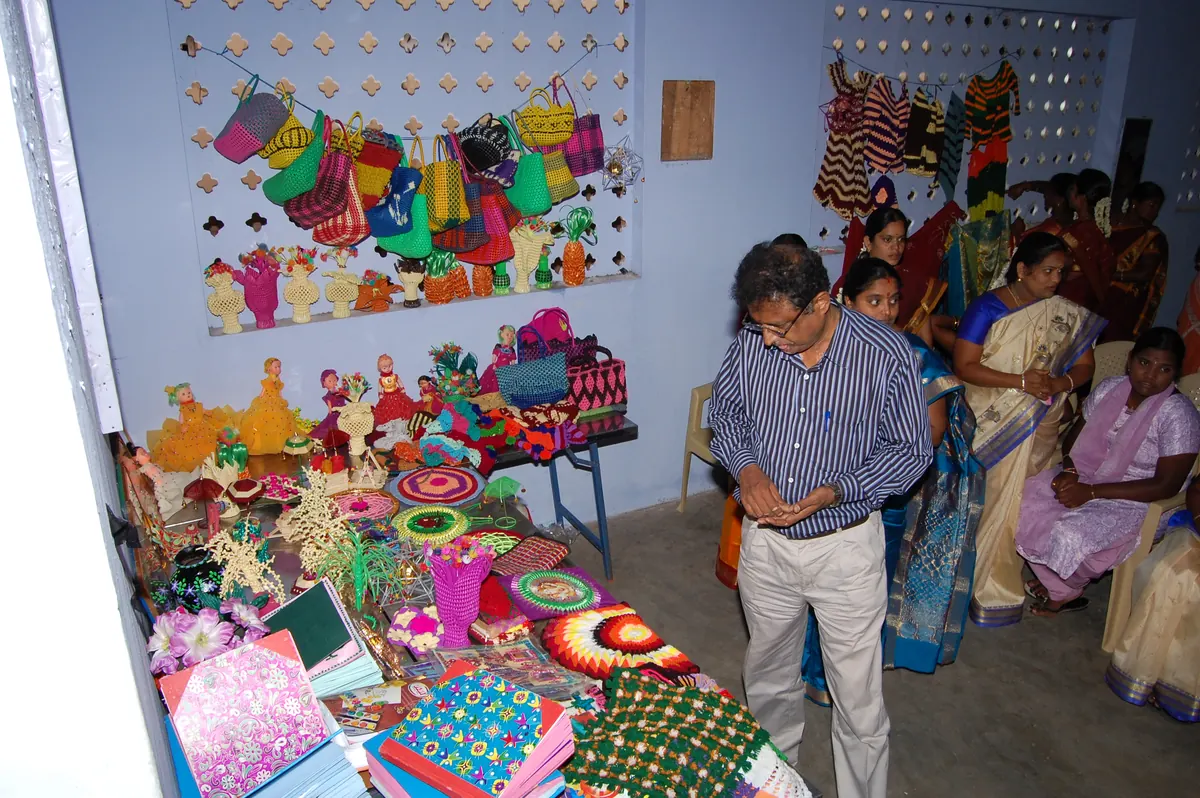 Display of handmade bags, dolls, and crafts during NWDT handicraft production training
