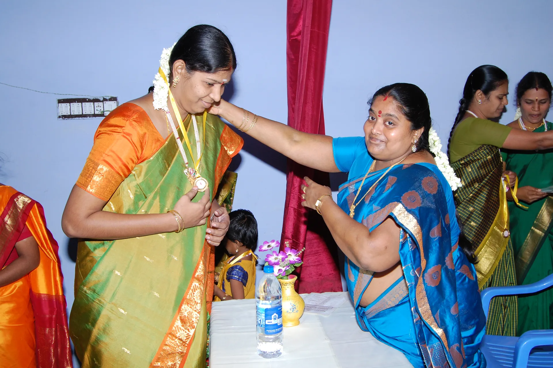 A participant receiving recognition at an NWDT programme event